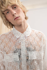 A man wearing Lace Shirt in Ivory by Mirkka Metsola.