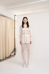 A woman wearing Mirkka Metsola Lace Shirt in ivory color.