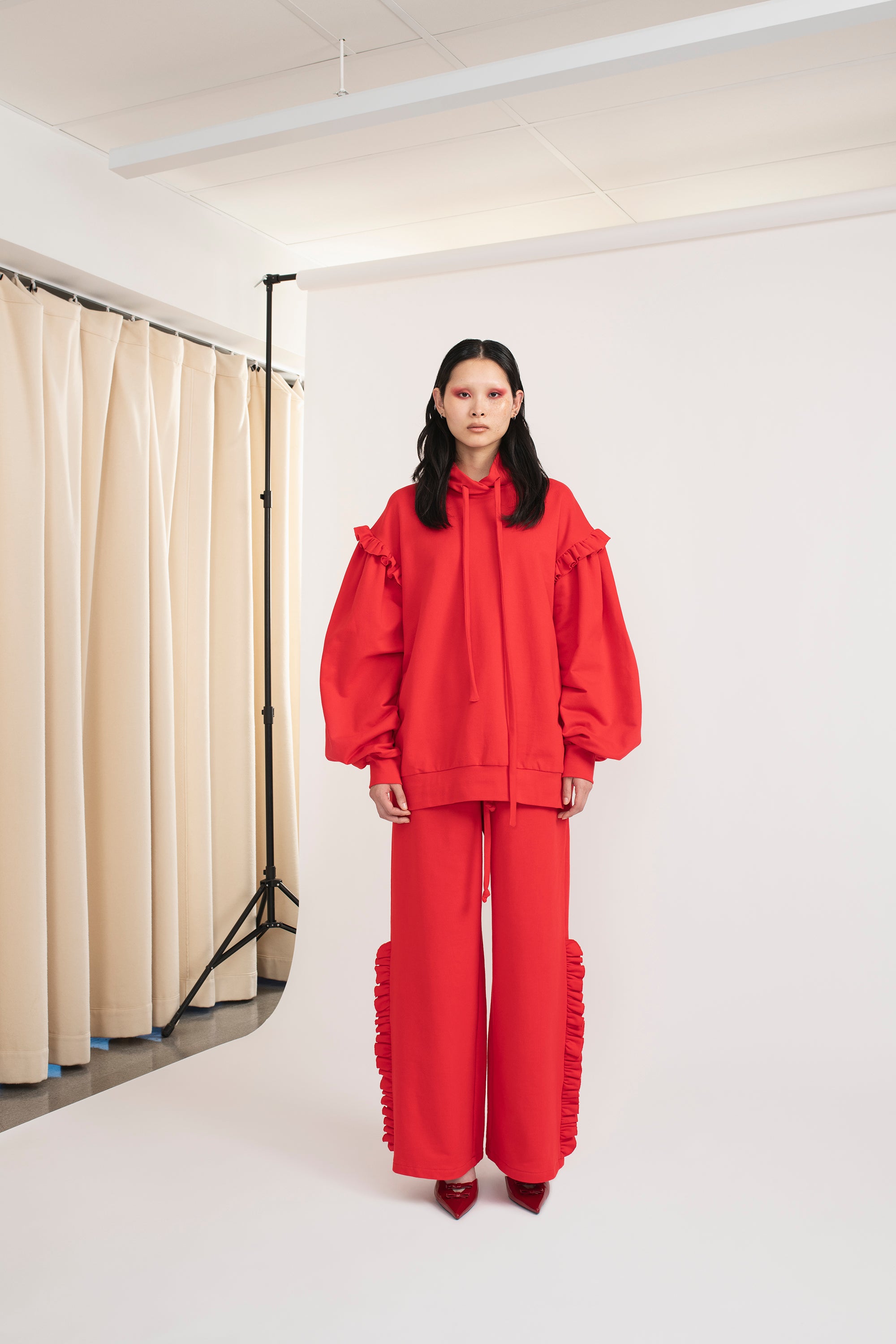 Mirkka Metsola Ruffle Hoodie in color red.