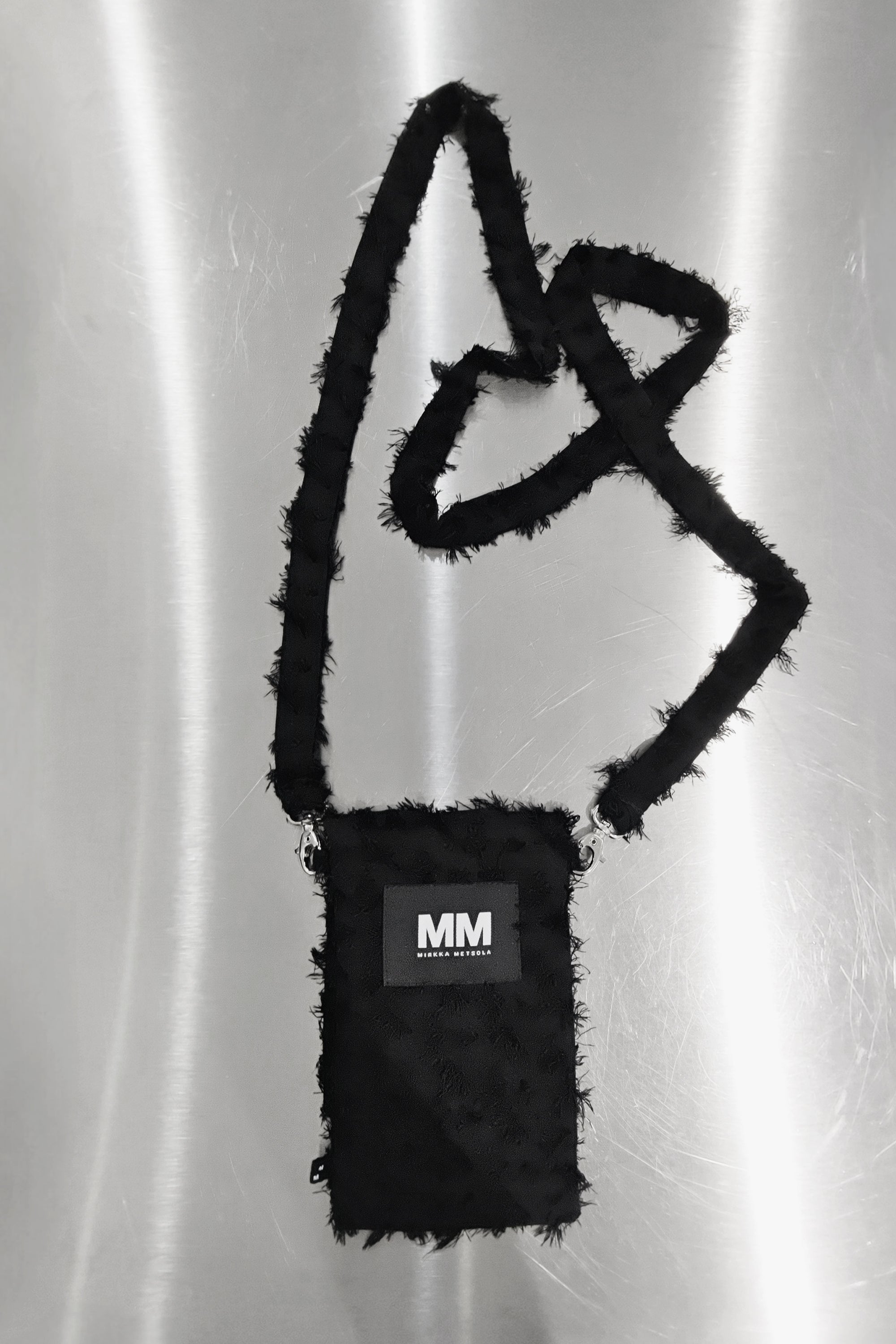 Phone Bag by Mirkka Metsola in Shredded Black colorway.