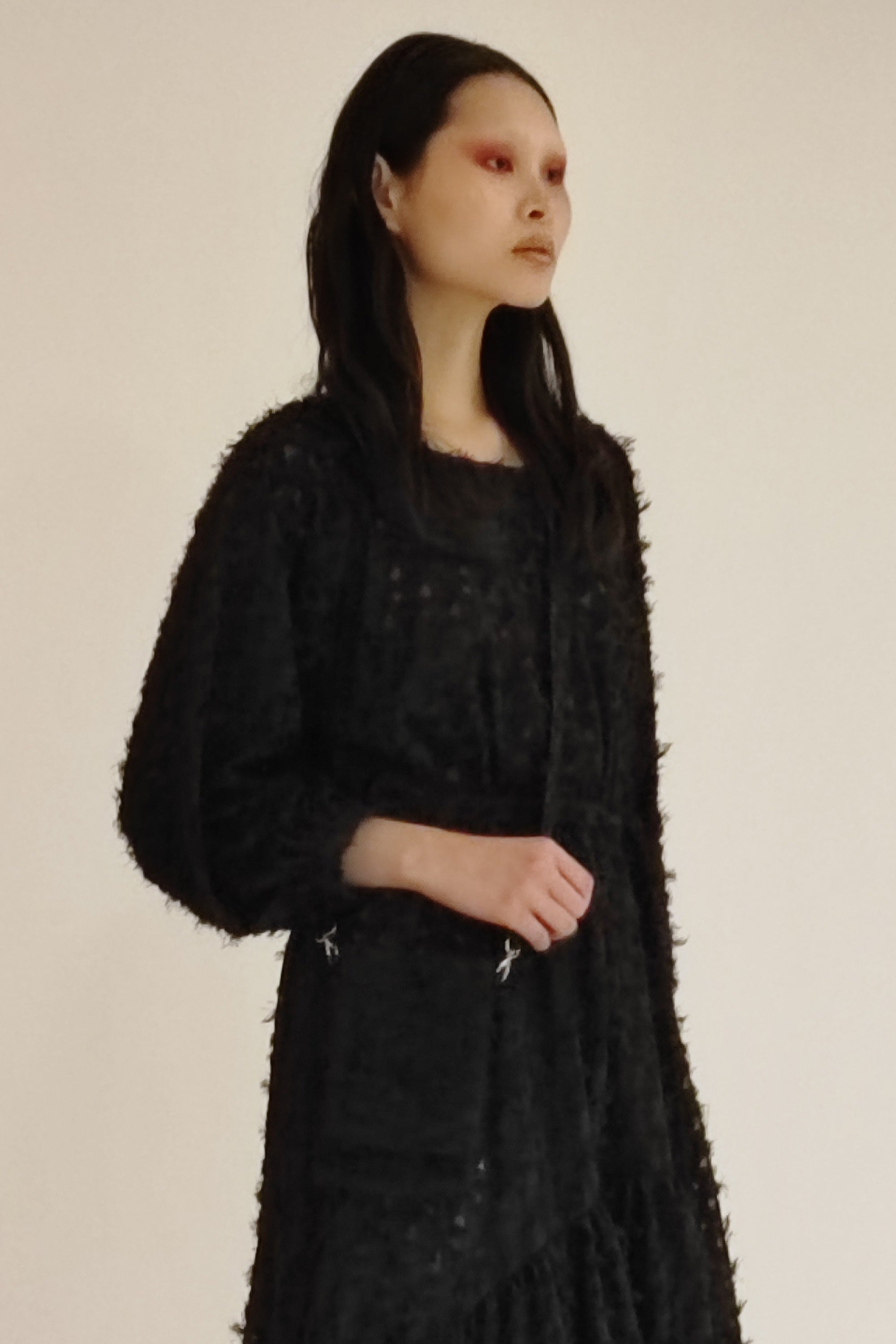 Woman wearing Phone Bag by Mirkka Metsola.