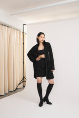 Mirkka Metsola Aurora Coat in color Shredded Black. 